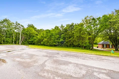 a view of swimming pool with an outdoor space and seating area