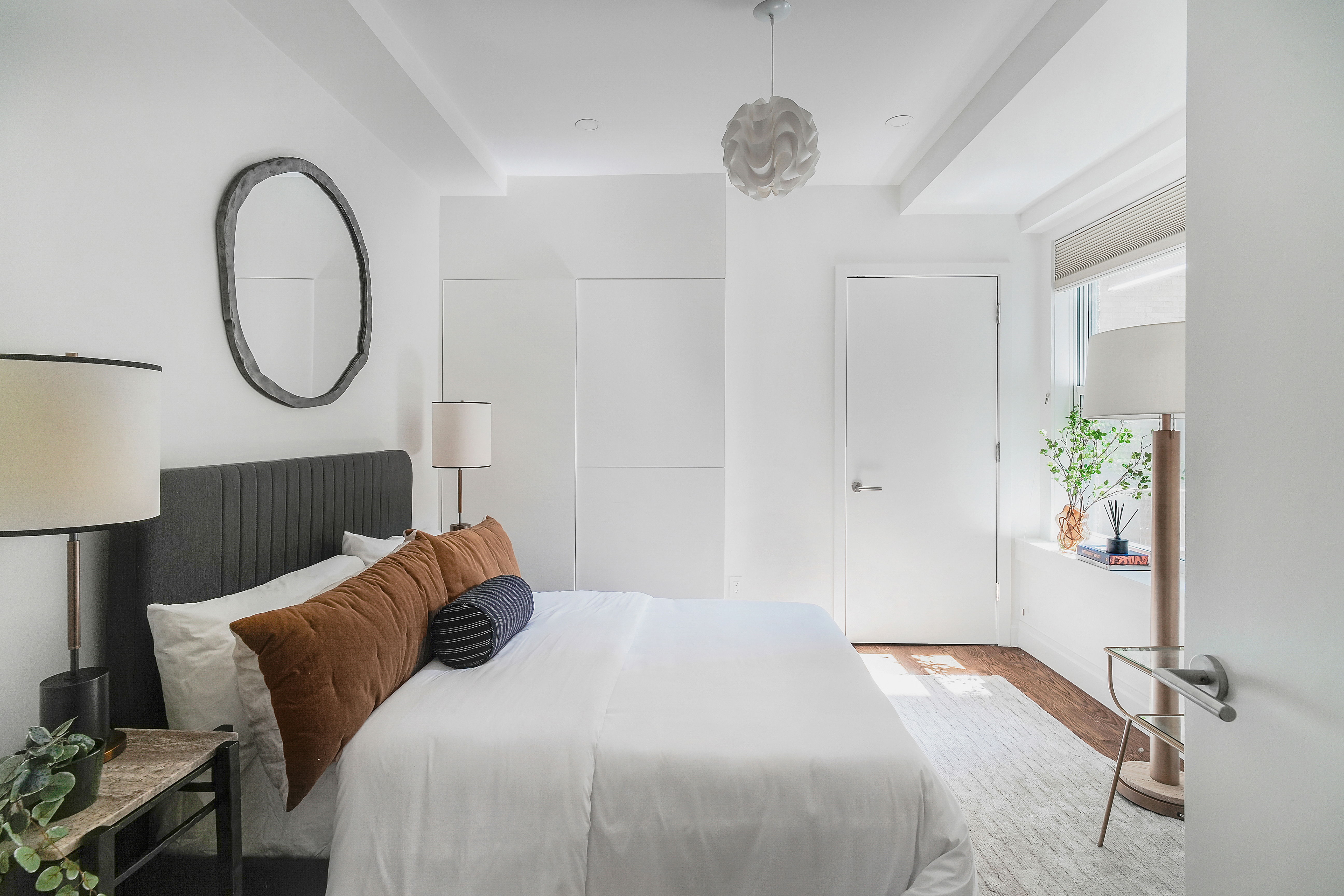 215 West 88th Street, Unit 3E Manhattan, NY 10024 - Photo 7 of 16 a bedroom with a bed and a chandelier