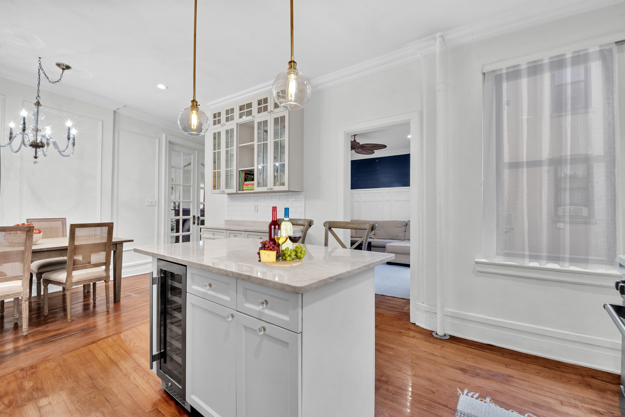 47 Fort Washington Avenue, Unit 55 Manhattan, NY 10032 - Photo 8 of 20 a kitchen with a sink dishwasher and a stove with wooden floor