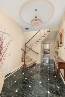 a kitchen with stainless steel appliances kitchen island granite countertop a stove