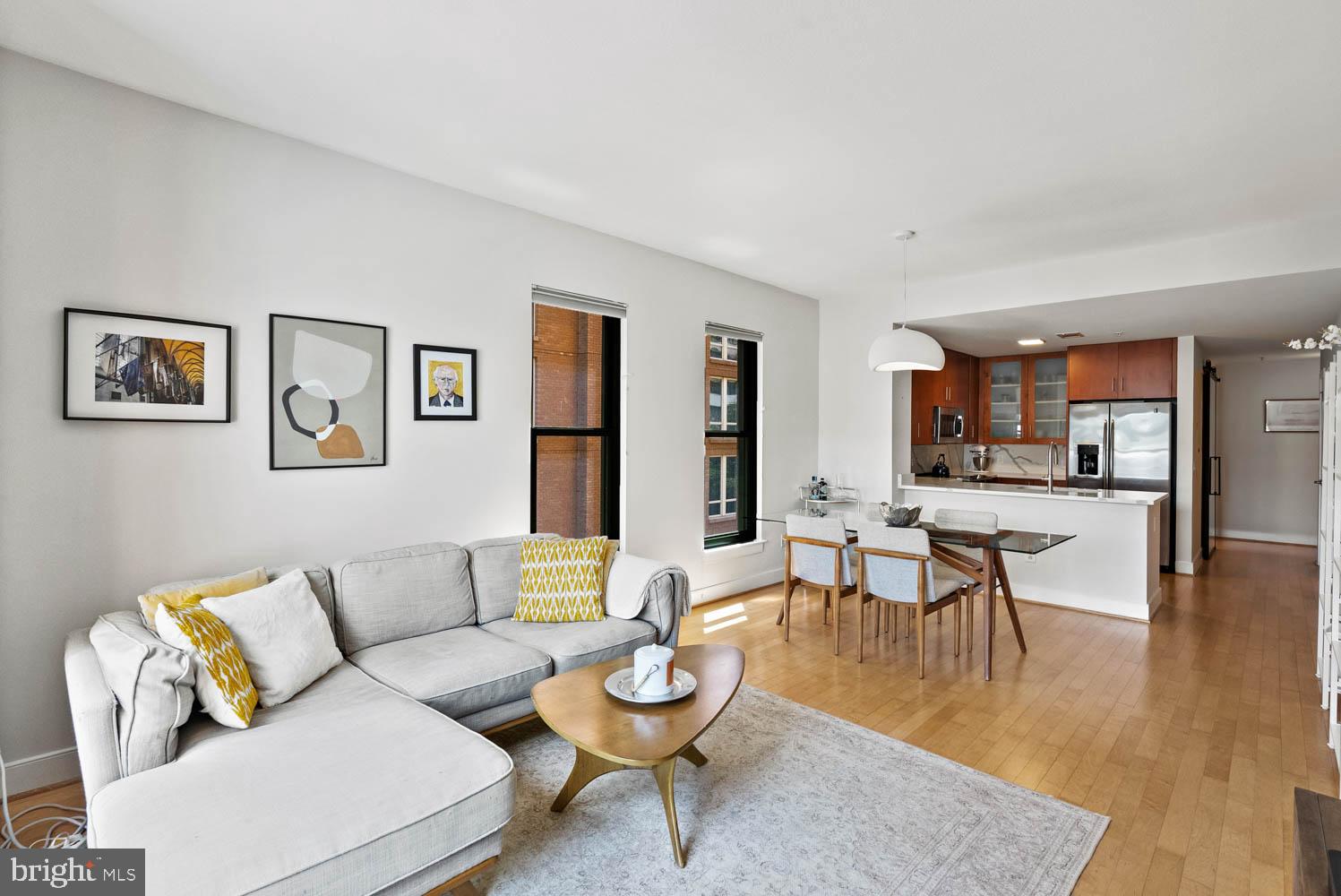 910 M Street Northwest, Unit 403 Washington, DC 20001 - Photo 4 of 31 a living room with furniture and view of kitchen