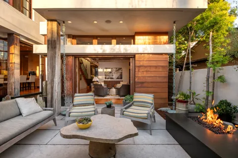 a view of a patio with a dining table and chairs