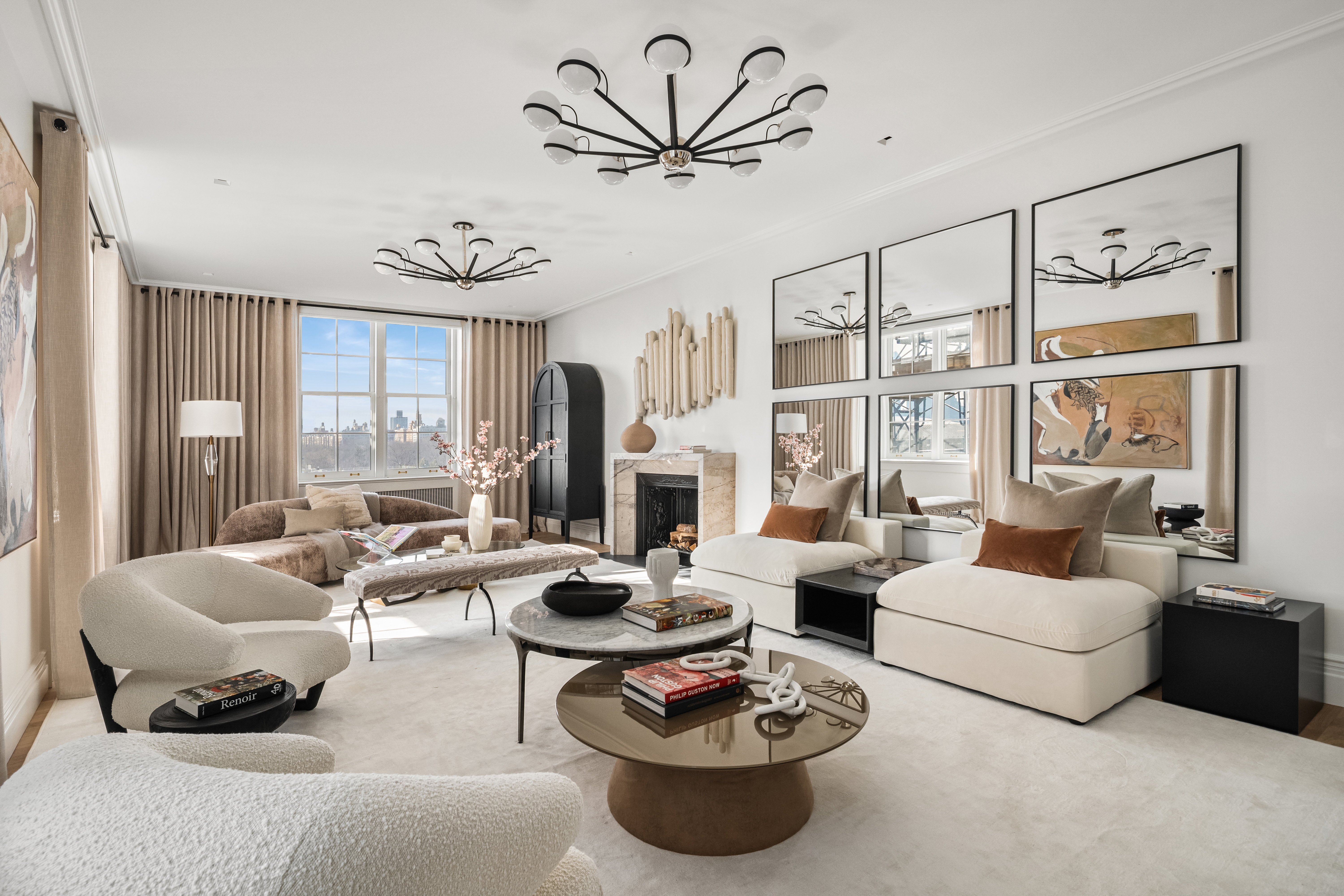 a living room with furniture large window and a table