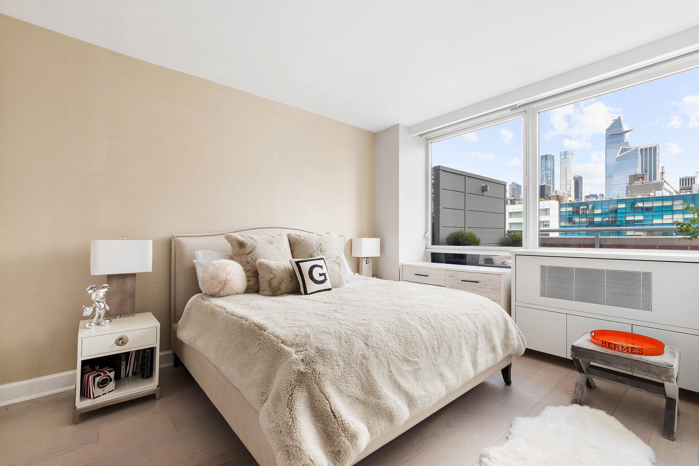 450 West 17th Street, Unit 1003 Manhattan, NY 10011 - Photo 8 of 9 a bedroom with a bed and a window