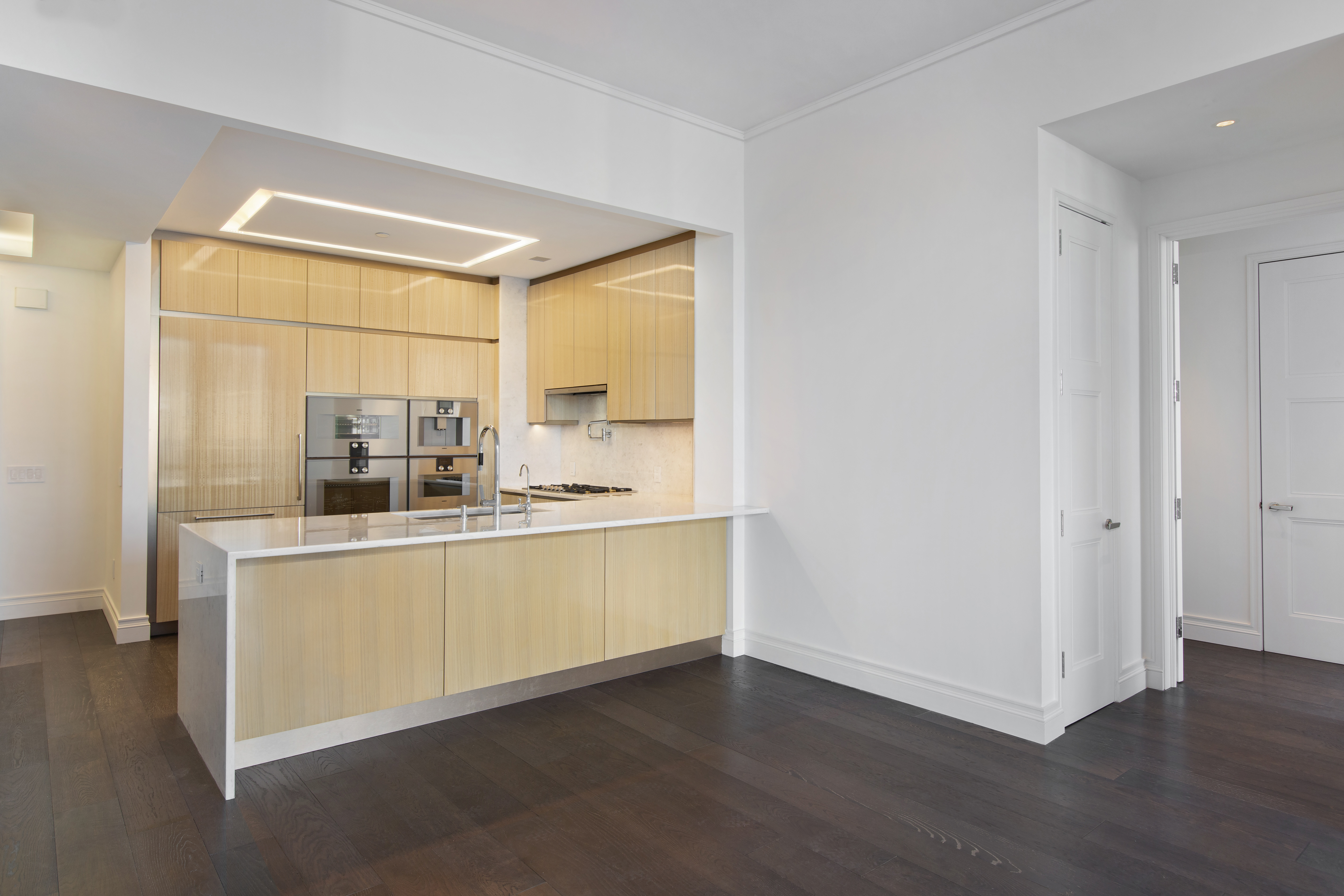 35 Hudson Yards, Unit 5805 Manhattan, NY 10001 - Photo 4 of 19 a kitchen with stainless steel appliances a sink and a window