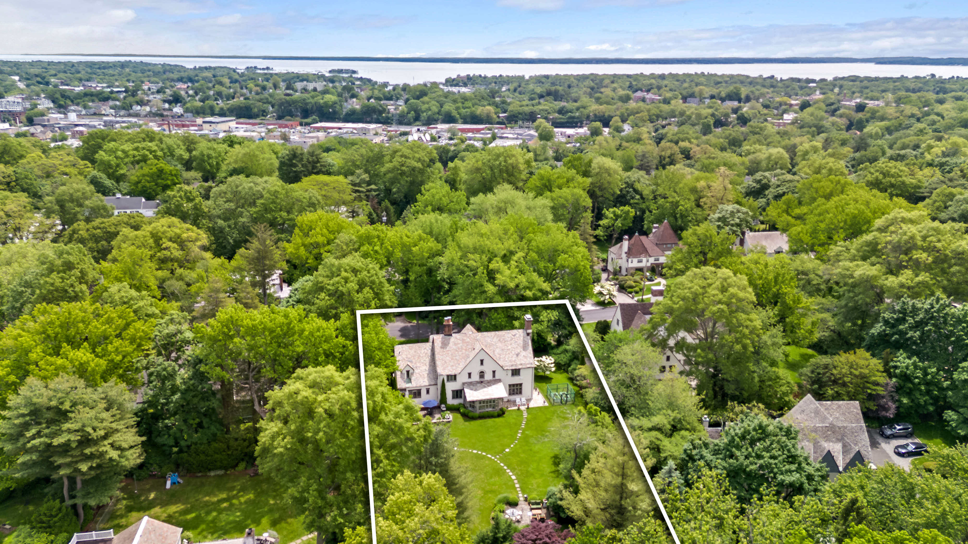 19 Avon Road Larchmont, NY 10538 - Photo 29 of 35 a view of a lush green forest with a street