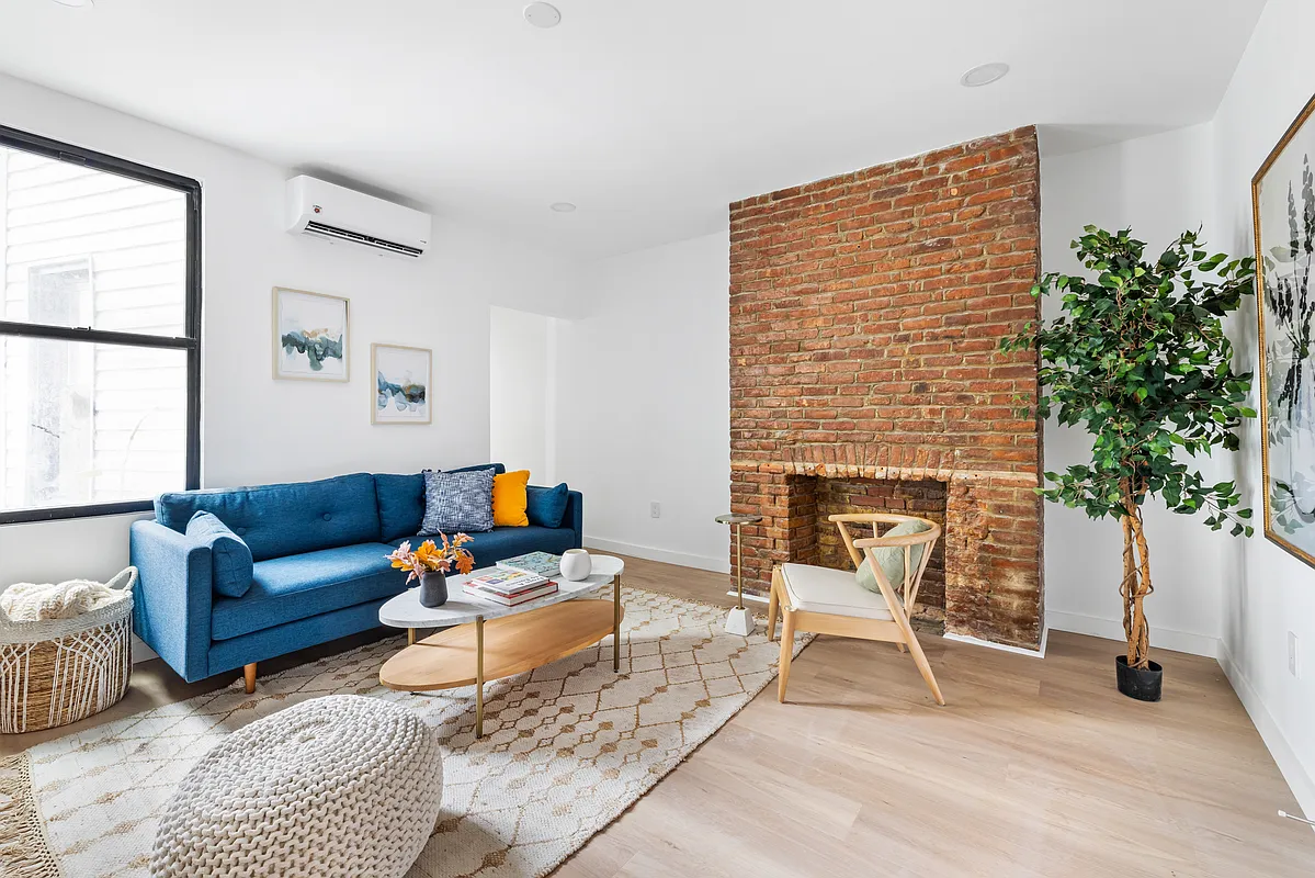 76 Meserole Avenue, Unit 2A Brooklyn, NY 11222 - Photo 3 of 10 a living room with furniture and a potted plant