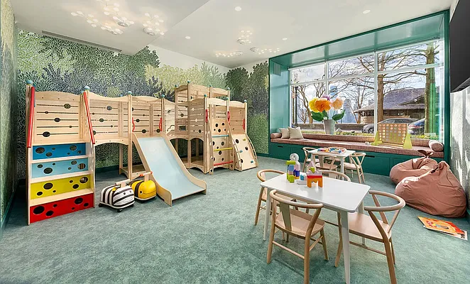 20 River Terrace, Unit 6Q Manhattan, NY 10282 - Photo 9 of 20 a play room with furniture