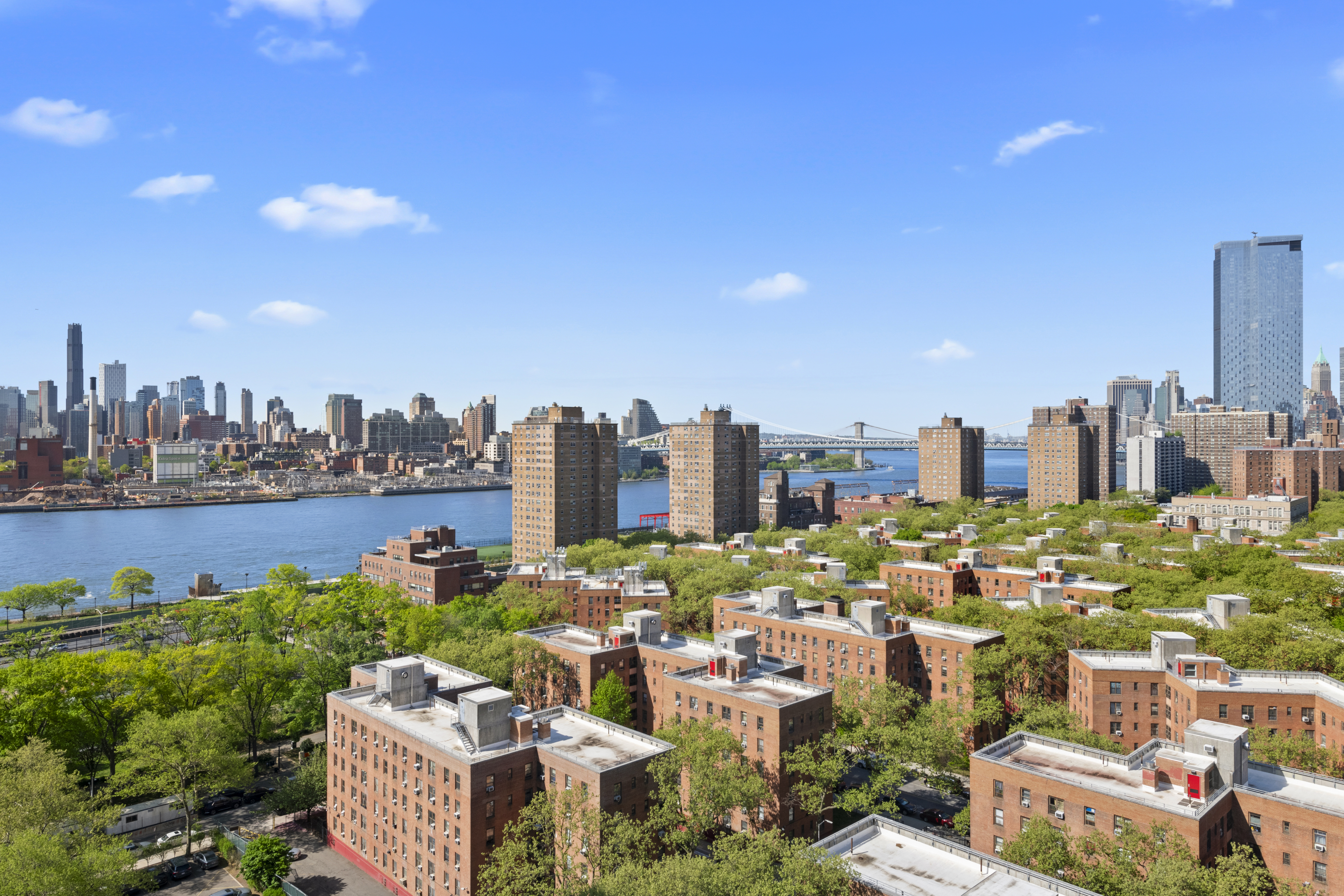 573 Grand Street, Unit D1707/1801 Manhattan, NY 10002 - Photo 23 of 24 a view of a city with tall buildings