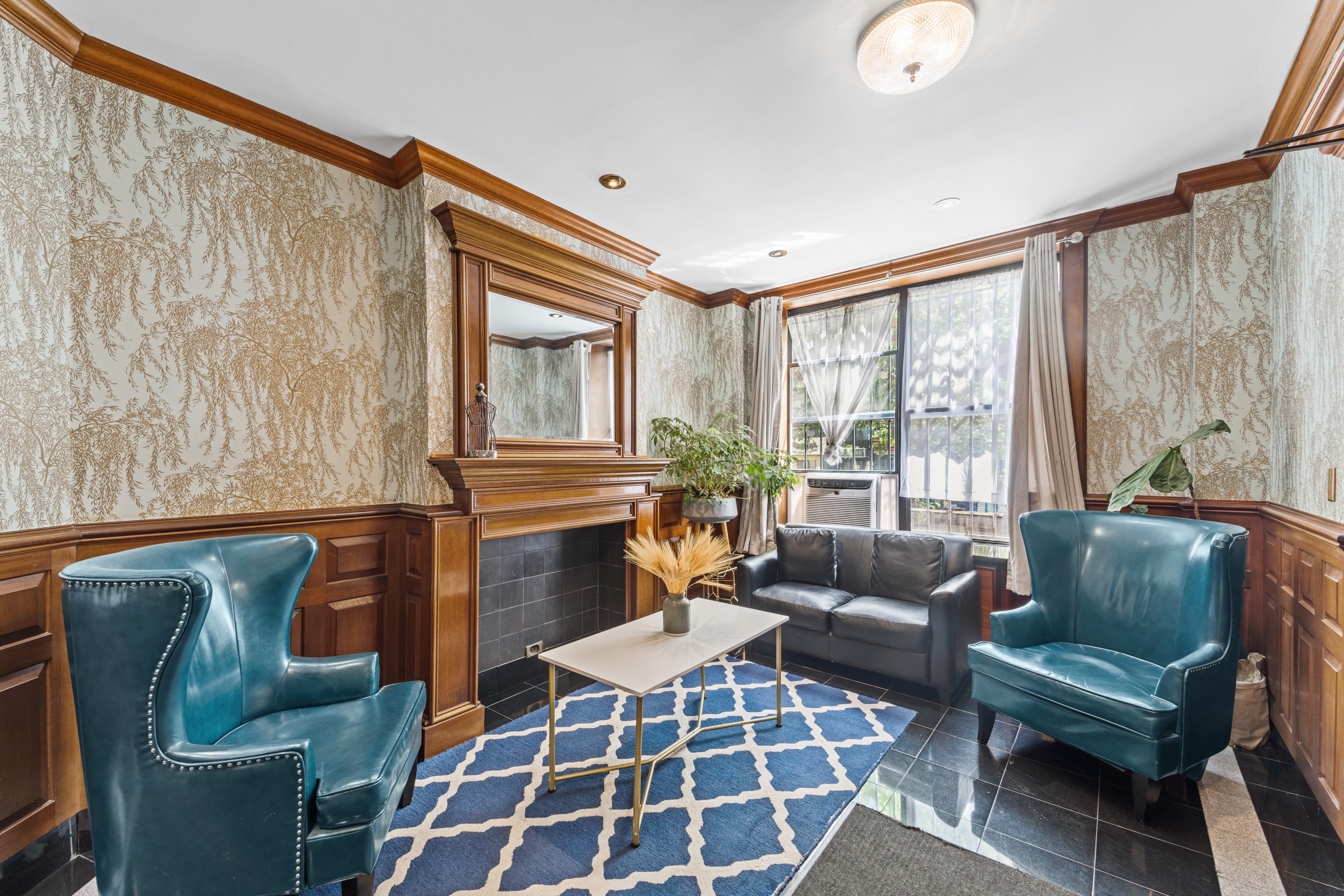 231 East 13th Street, Unit 6E Manhattan, NY 10003 - Photo 7 of 9 a living room with furniture and a floor to ceiling window