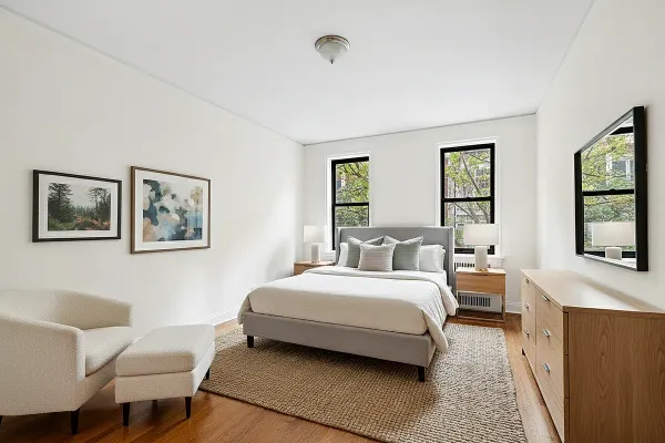 a bedroom with a bed and a couch