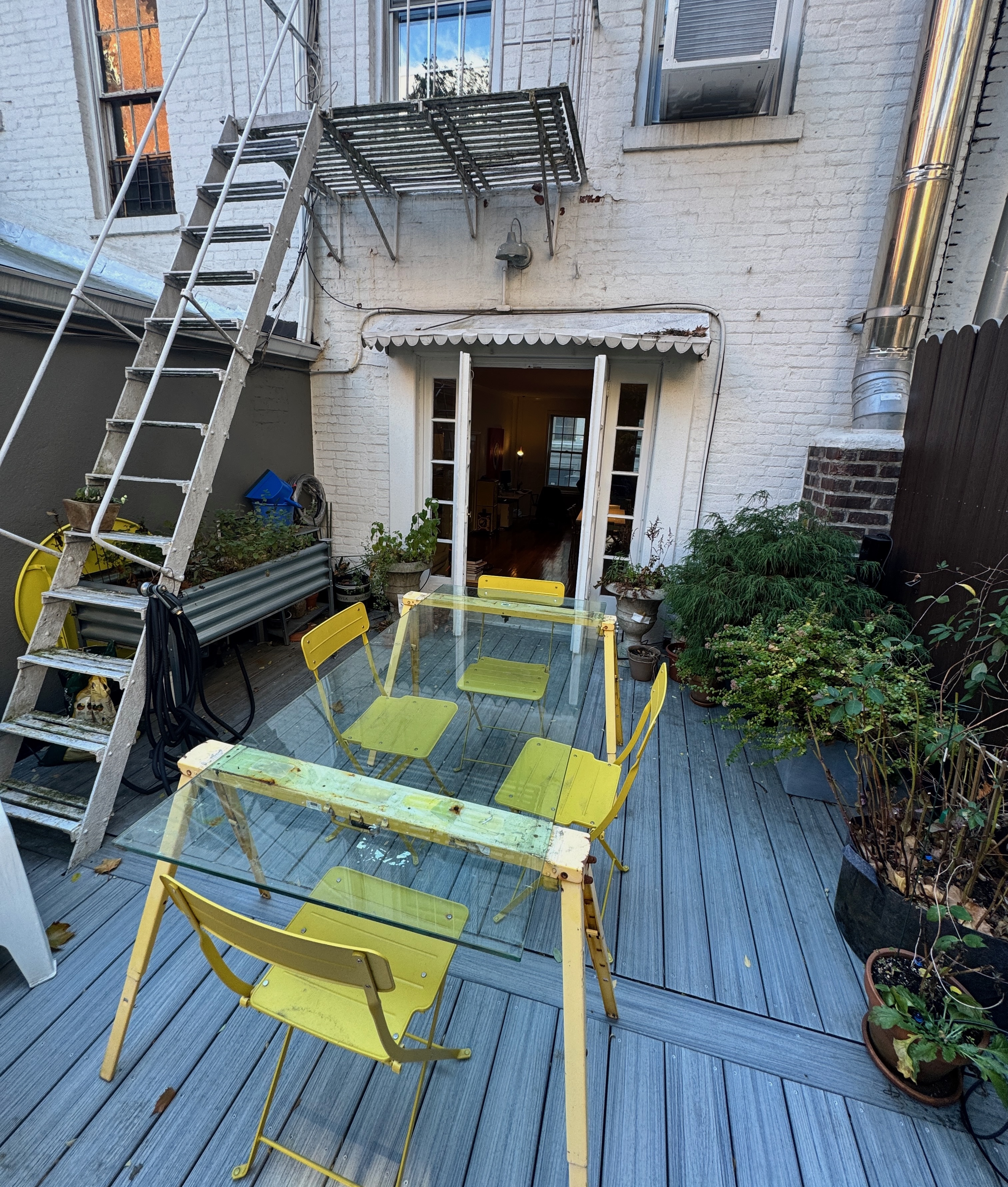 19 Vandam Street, Unit 2 Manhattan, NY 10014 - Photo 4 of 19 a view of house with wooden deck and furniture