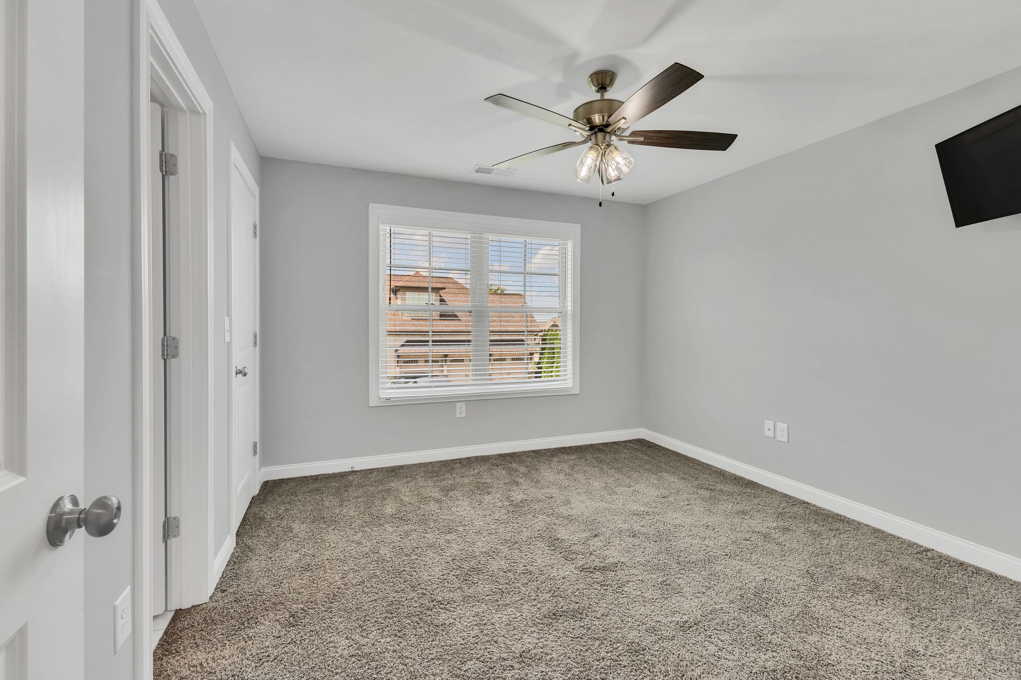 1484 Overlook Point Clarksville, TN 37043 - Photo 48 of 53 an empty room with windows and ceiling fan