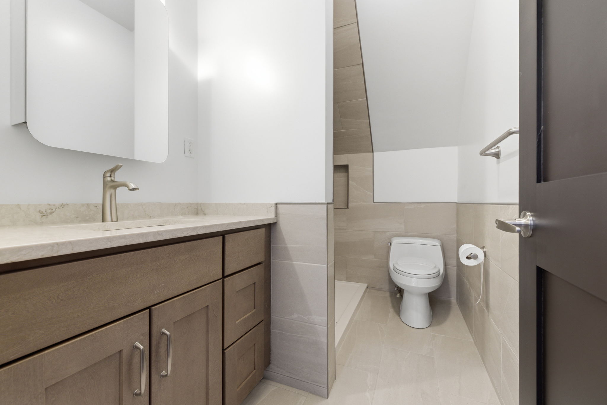 317 Main Street, Unit 7 Wakefield, MA 01880 - Photo 9 of 17 a bathroom with a sink toilet and mirror