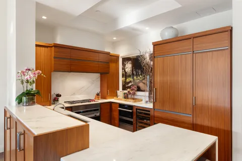 a kitchen with stainless steel appliances a sink and cabinets