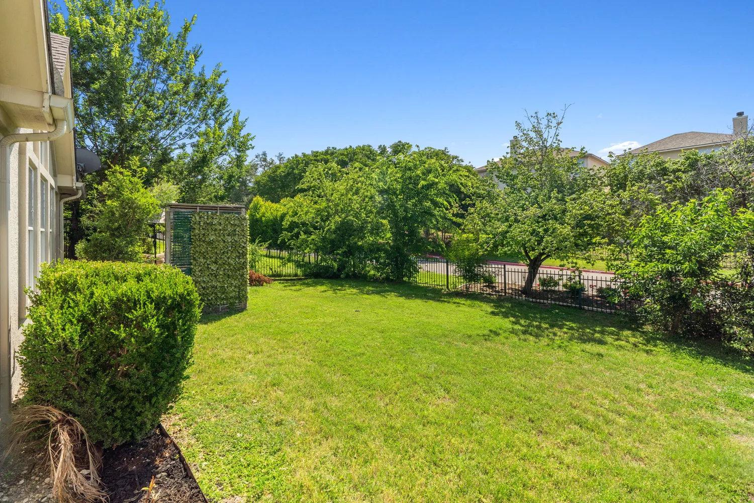a backyard of a house with lots of green space