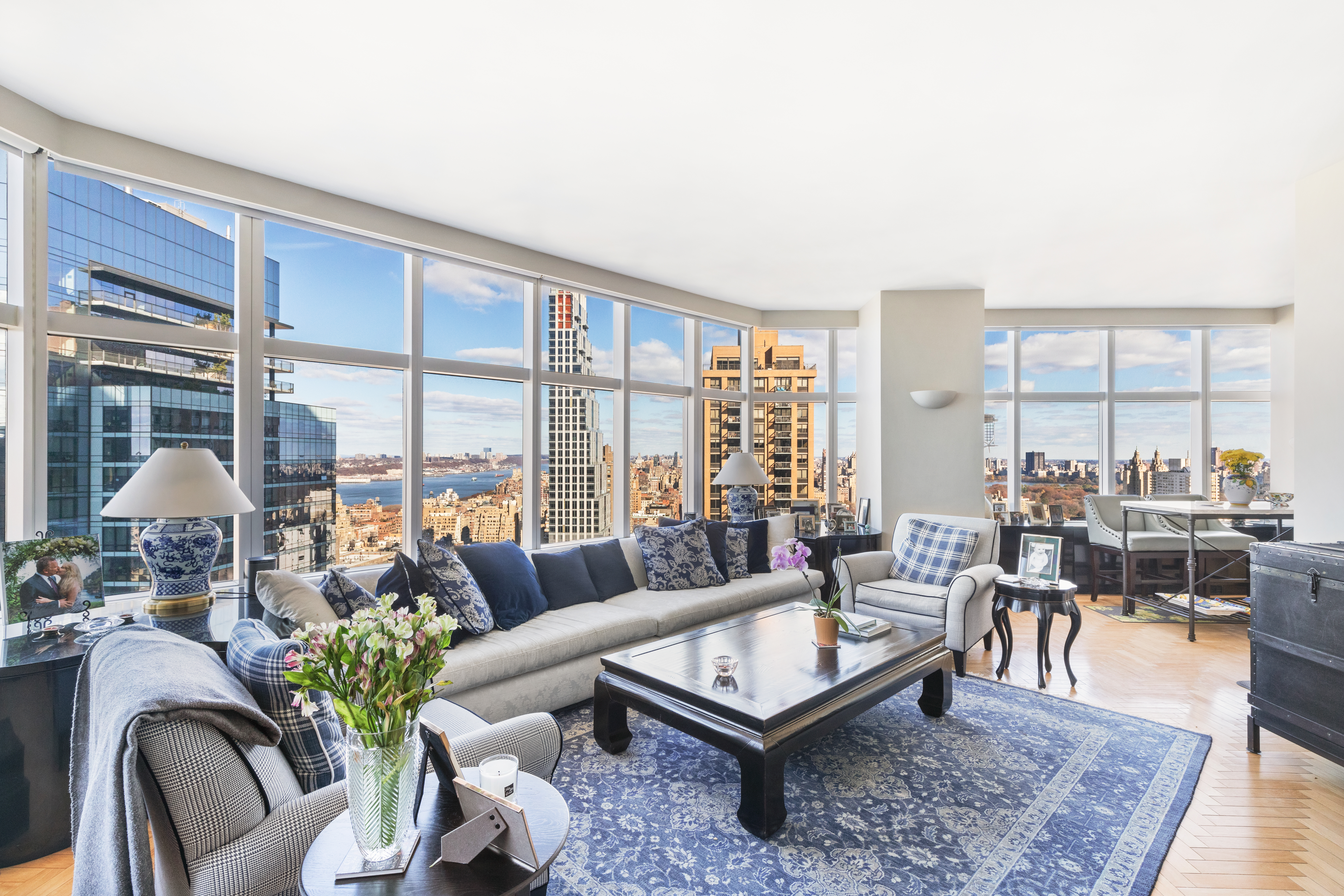 160 West 66th Street, Unit 42AB Manhattan, NY 10023 - Photo 1 of 15 a living room with furniture and a large window