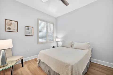 a bedroom with a bed and a chair