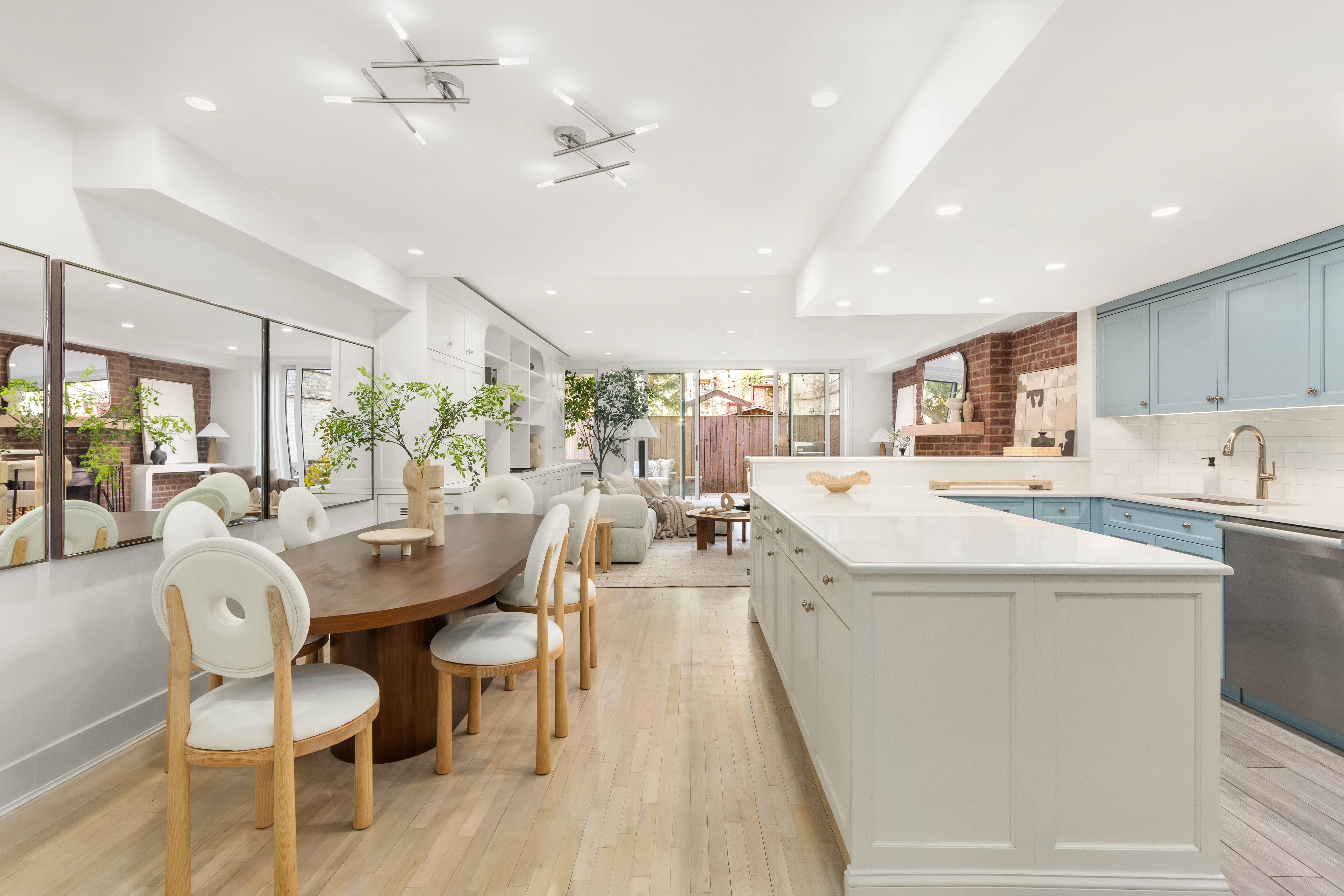 31 West 93rd Street, Unit 1D Manhattan, NY 10025 - Photo 5 of 18 a living room with stainless steel appliances kitchen island granite countertop furniture and a dining table