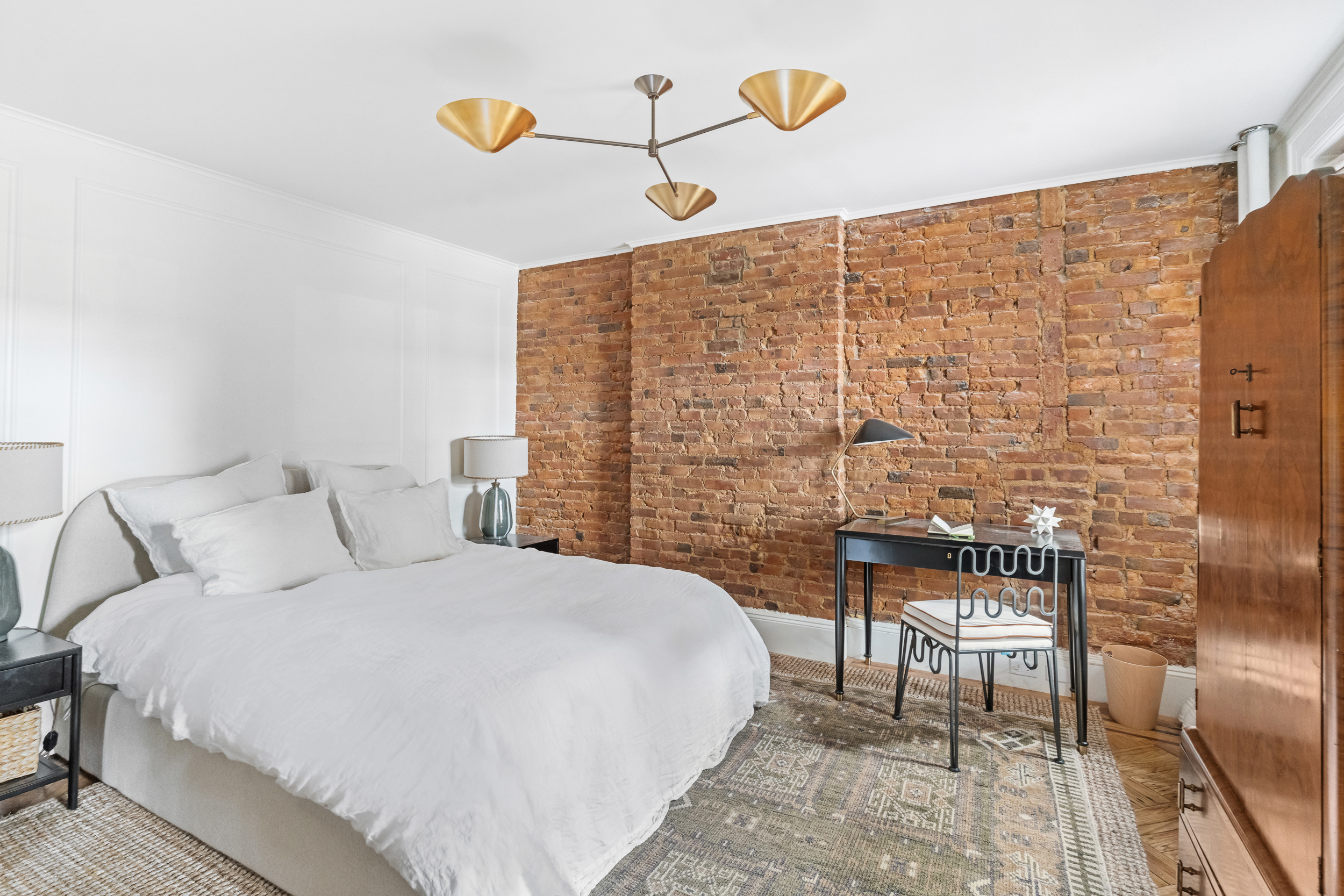 479 4th Street, Unit GARDEN Brooklyn, NY 11215 - Photo 4 of 8 a bedroom with a bed and a chandelier