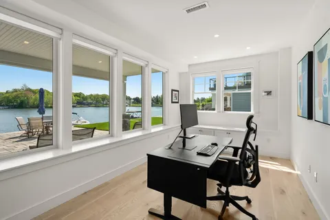 a view of a livingroom with table & chairs