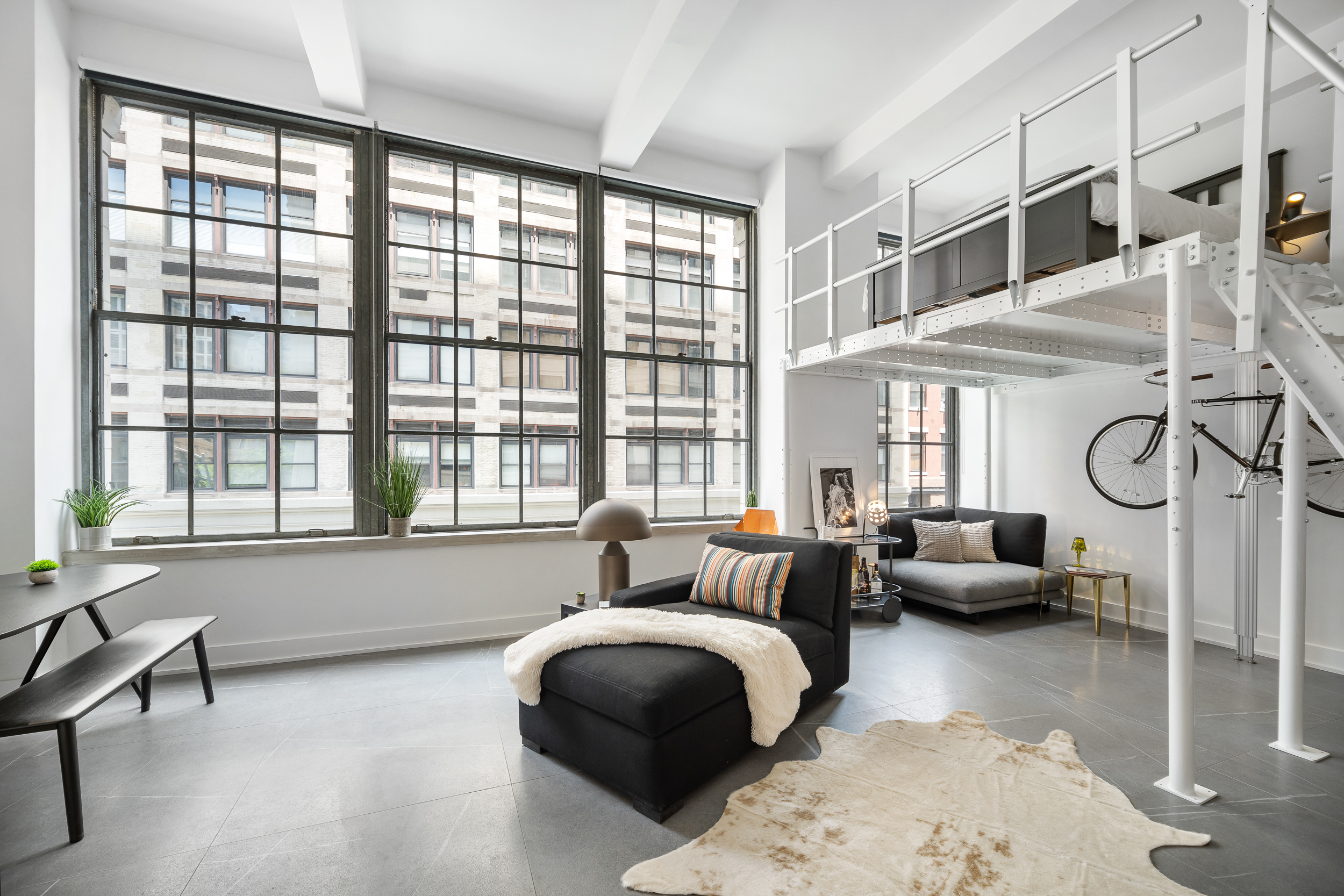 111 4th Avenue, Unit 1J Manhattan, NY 10003 - Photo 2 of 11 a bedroom with furniture and windows