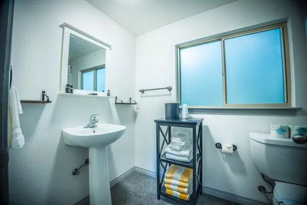 a bedroom with a bed and flat screen tv