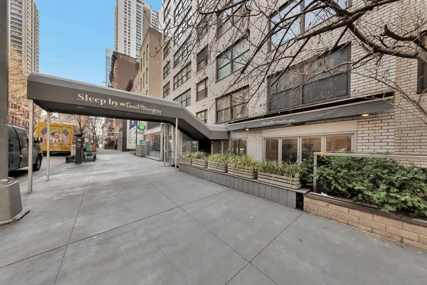 a view of a building with sitting area