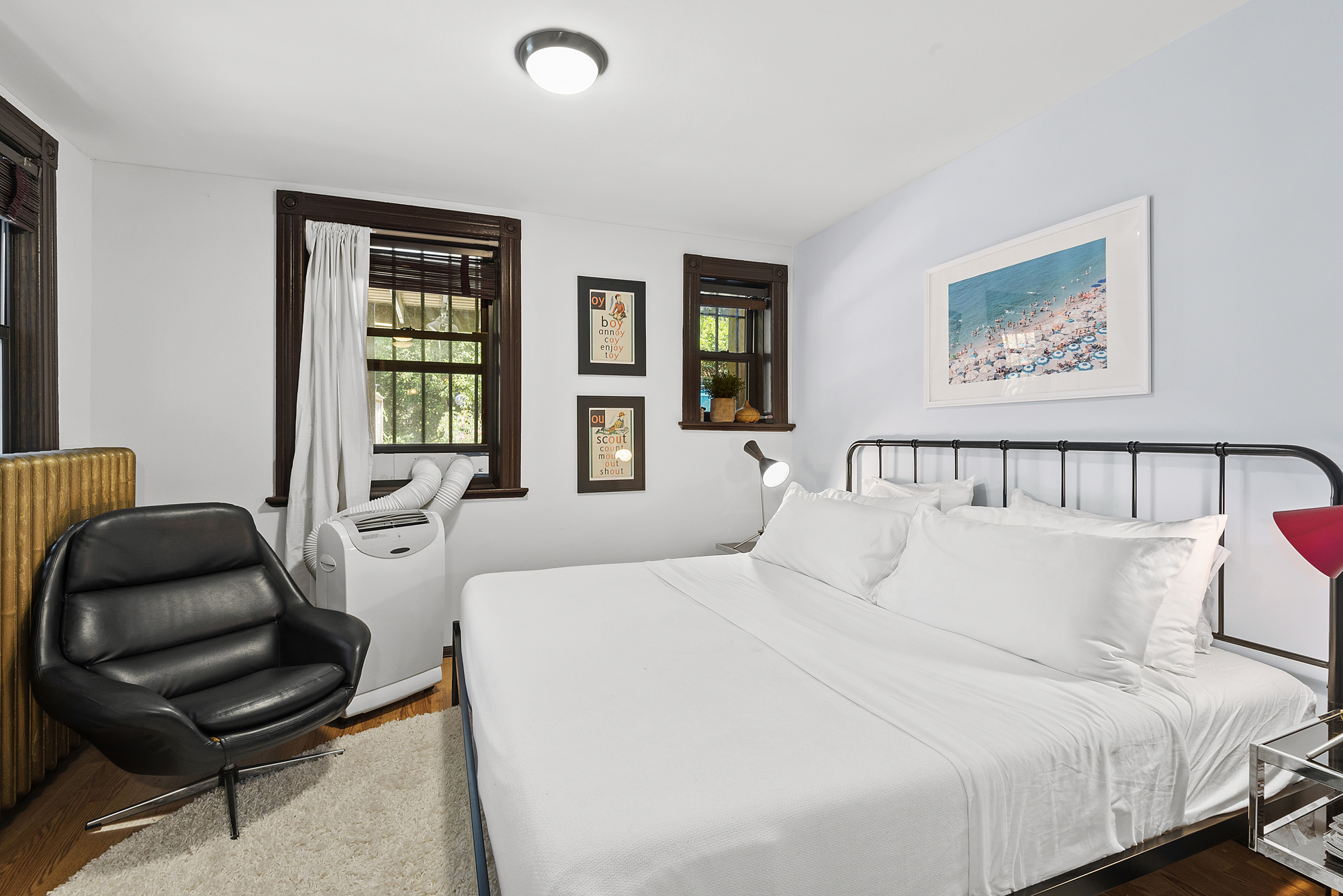 291 Sterling Place Brooklyn, NY 11238 - Photo 15 of 19 a bedroom with a bed and a chair