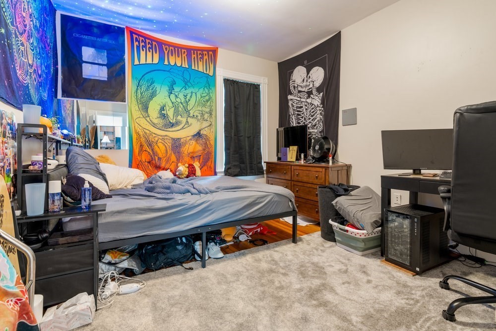 24 Buttonwood Street Boston, MA 02125 - Photo 23 of 43 a room with musical instruments