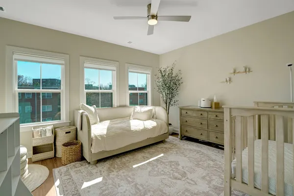 a bed room with a bed and a window