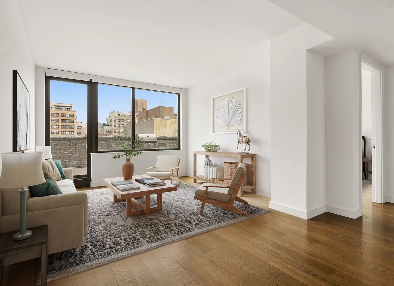 a living room with furniture and large windows