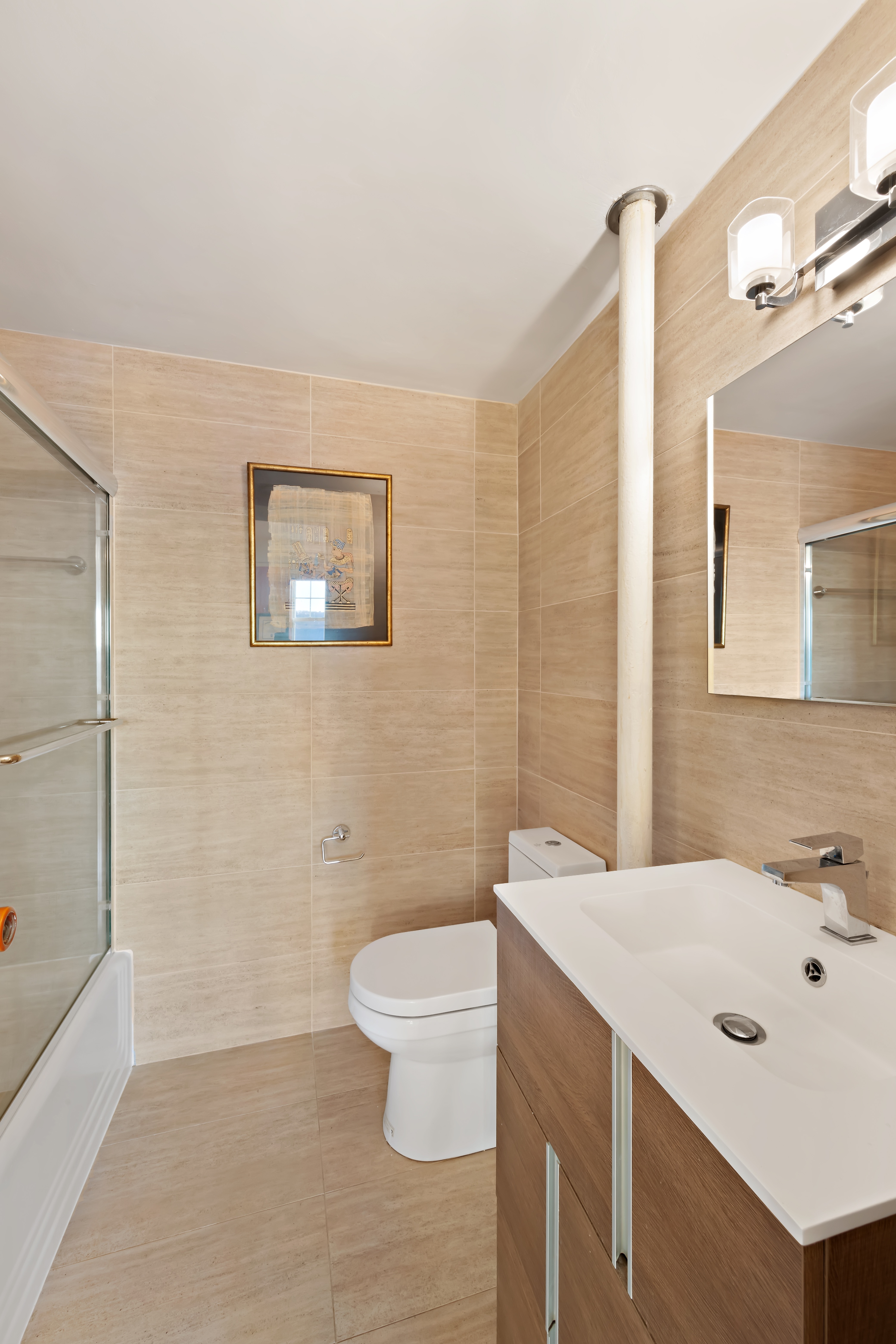 160 Cabrini Boulevard, Unit 19 Manhattan, NY 10033 - Photo 12 of 27 a bathroom with a sink a toilet and shower