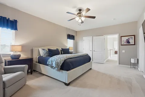 a bedroom with a bed and a walk in closet