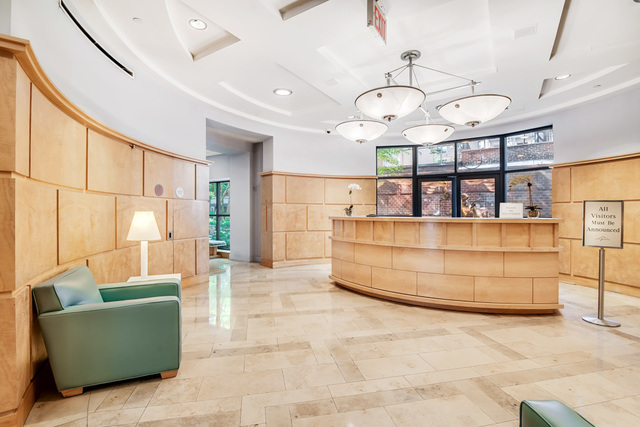 404 East 76th Street, Unit 4M Manhattan, NY 10021 - Photo 11 of 13 a living room with furniture and a large window
