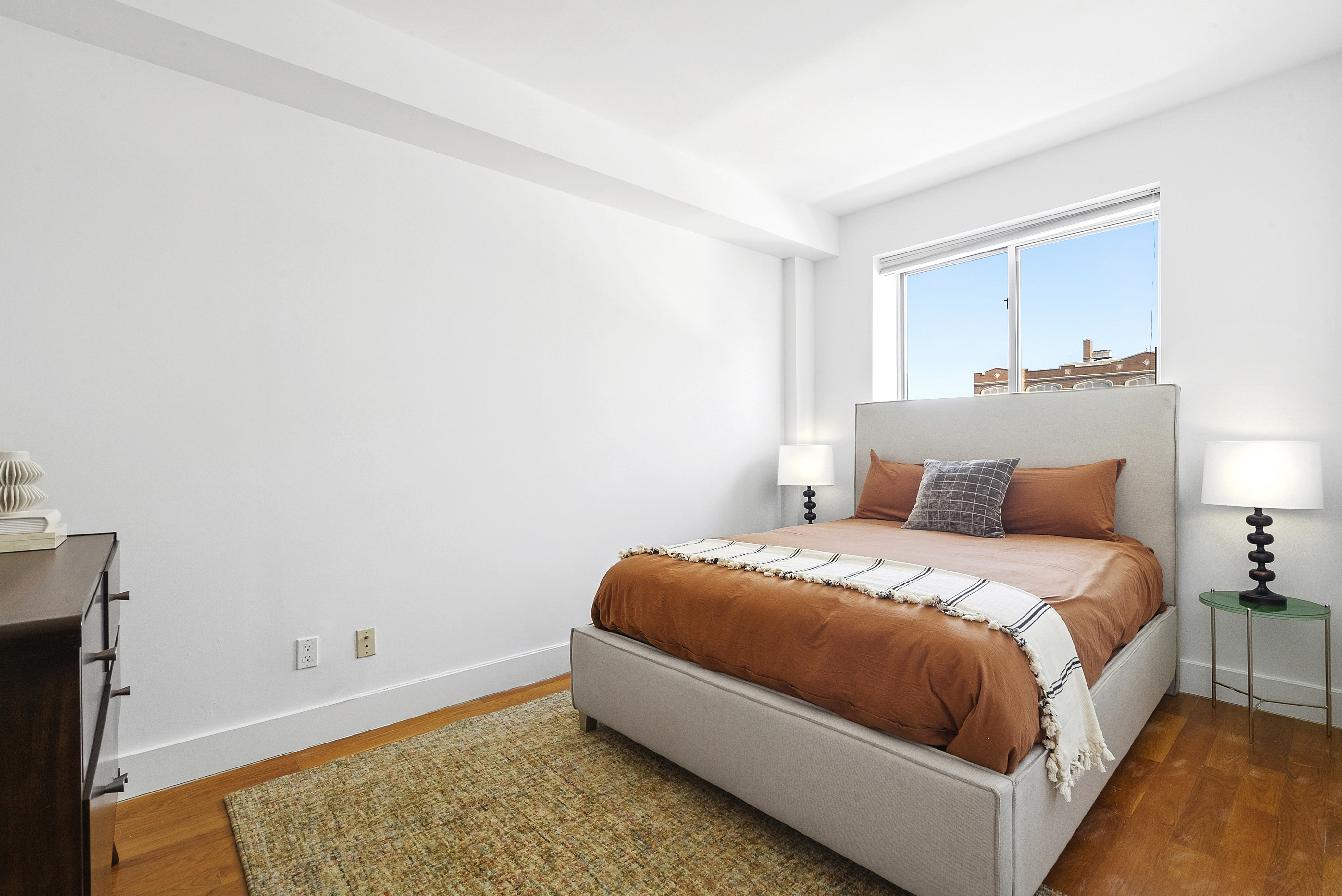 201 Spencer Street, Unit 3A Brooklyn, NY 11205 - Photo 7 of 11 a spacious bedroom with a bed and a window