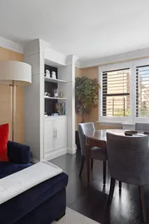 a dining room with furniture and window