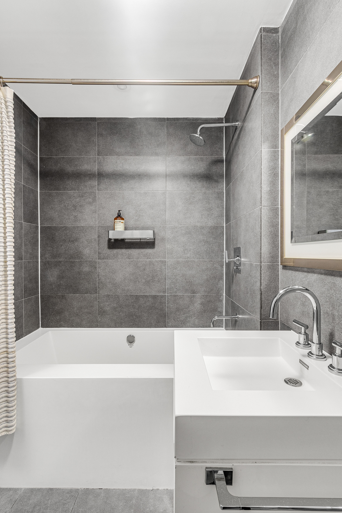 444 West 19th Street, Unit 701 Manhattan, NY 10011 - Photo 8 of 11 a bathroom with a bathtub and a sink