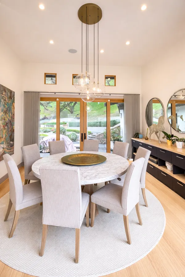 a dining room with furniture and window