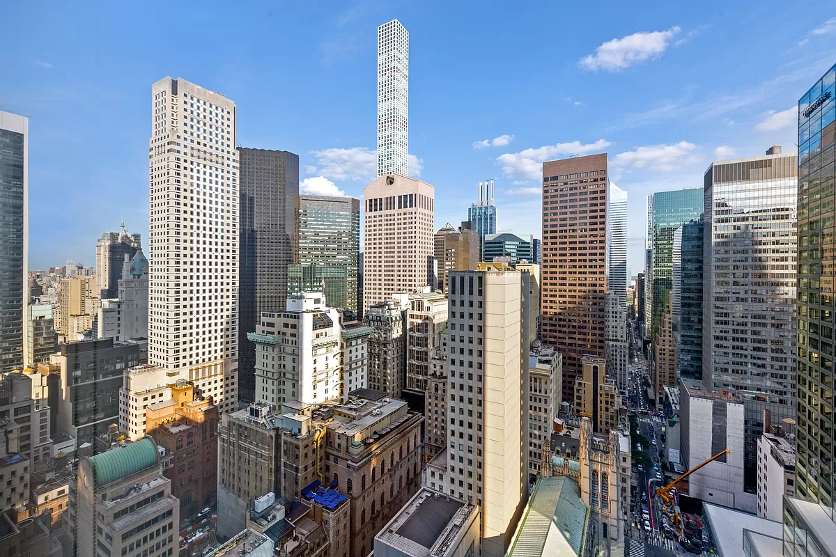 15 West 53rd Street, Unit 31C Manhattan, NY 10019 - Photo 8 of 14 a city view with tall buildings