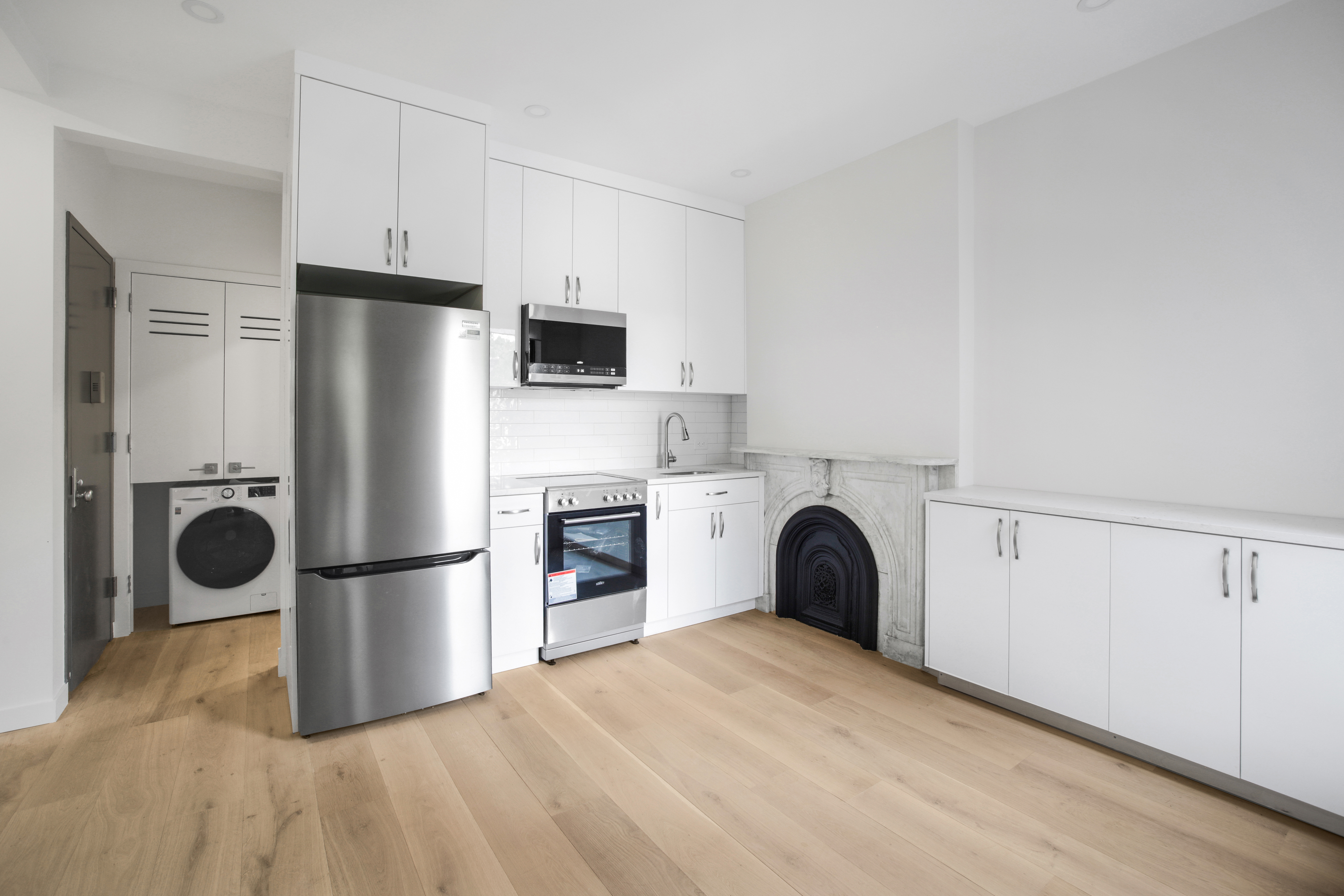94 6th Avenue, Unit 3R Brooklyn, NY 11217 - Photo 2 of 12 a kitchen with a refrigerator and a stove