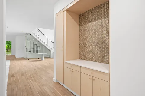 a view of entryway with wooden floor