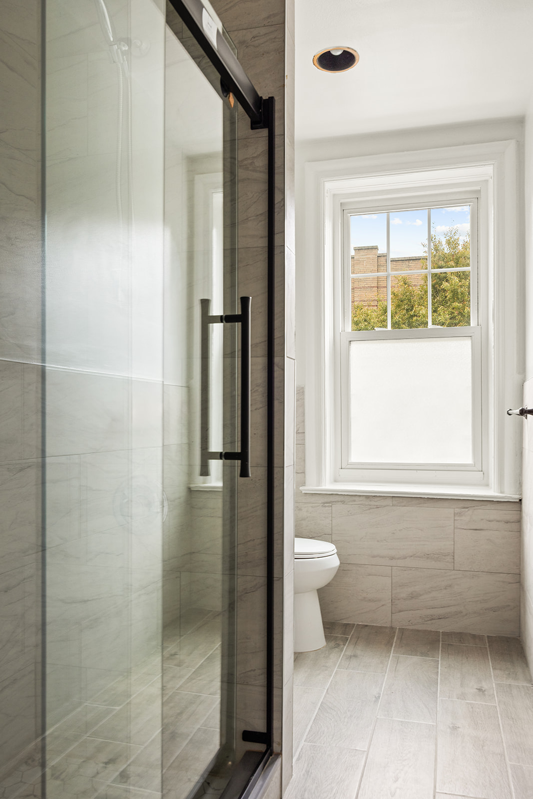 1523 11th Avenue, Unit 2 Brooklyn, NY 11215 - Photo 9 of 11 a bathroom with a toilet and a shower
