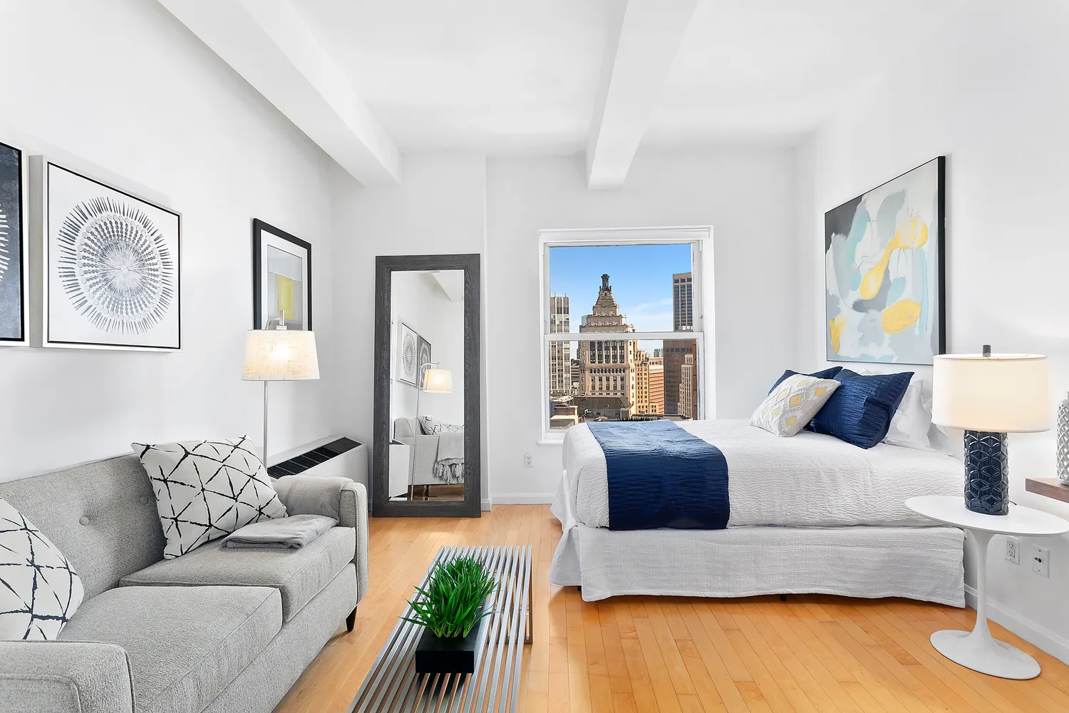 a living room with furniture and painting on the wall