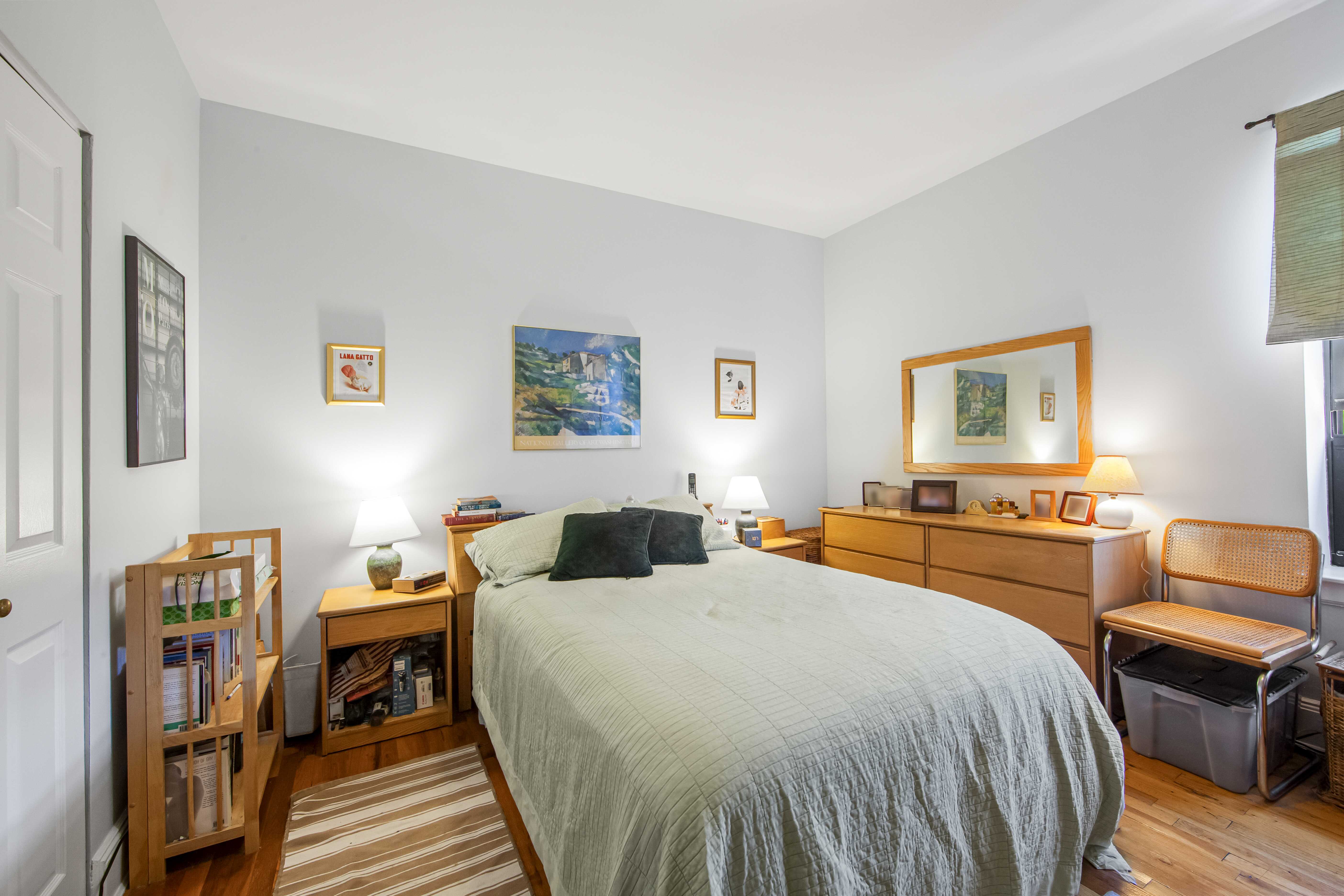 254 Park Place, Unit 4B Brooklyn, NY 11238 - Photo 7 of 12 a bedroom with a bed and wooden floor