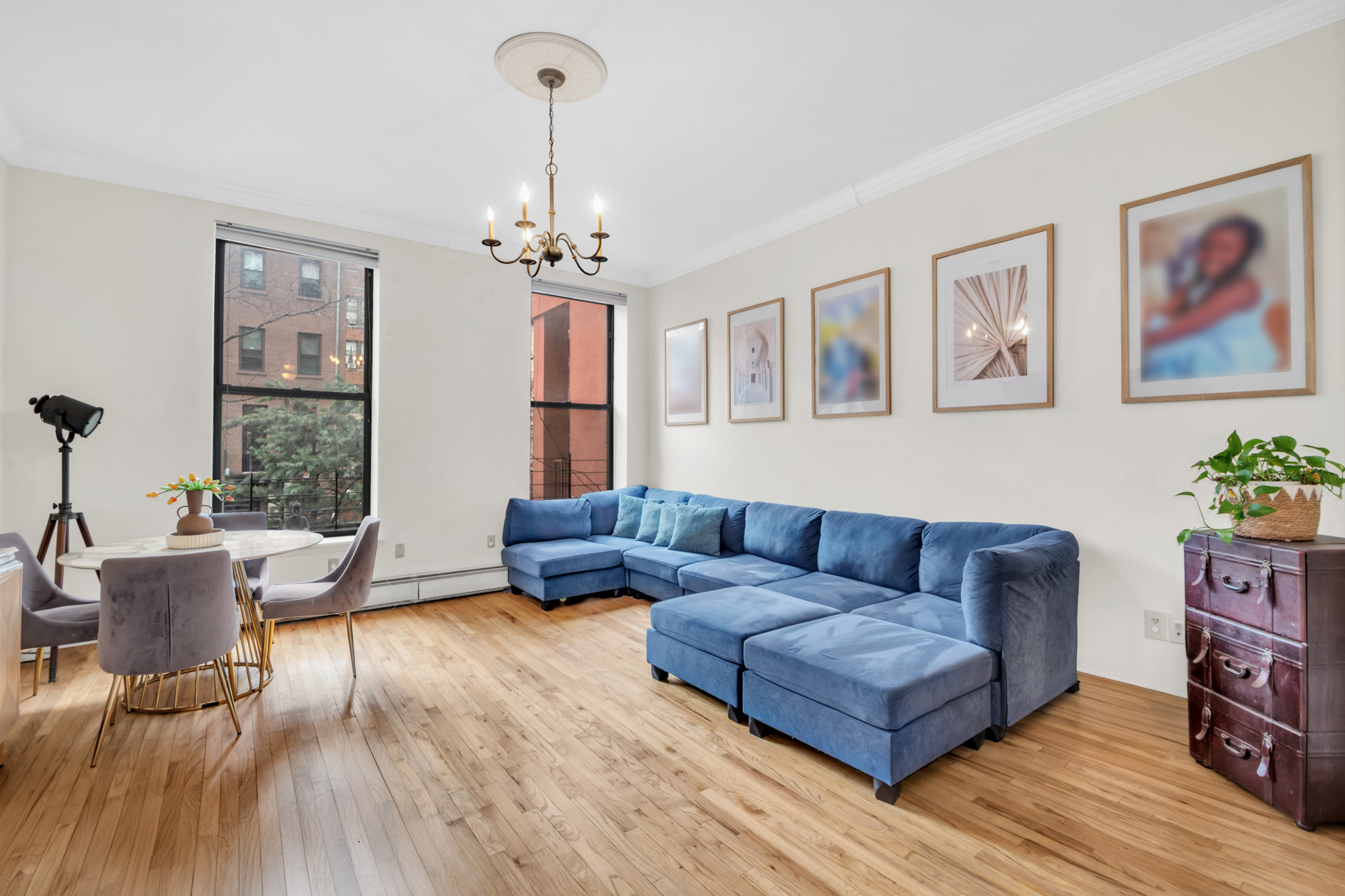 137 West 126th Street, Unit 1 Manhattan, NY 10027 - Photo 2 of 12 a living room with furniture and a wooden floor