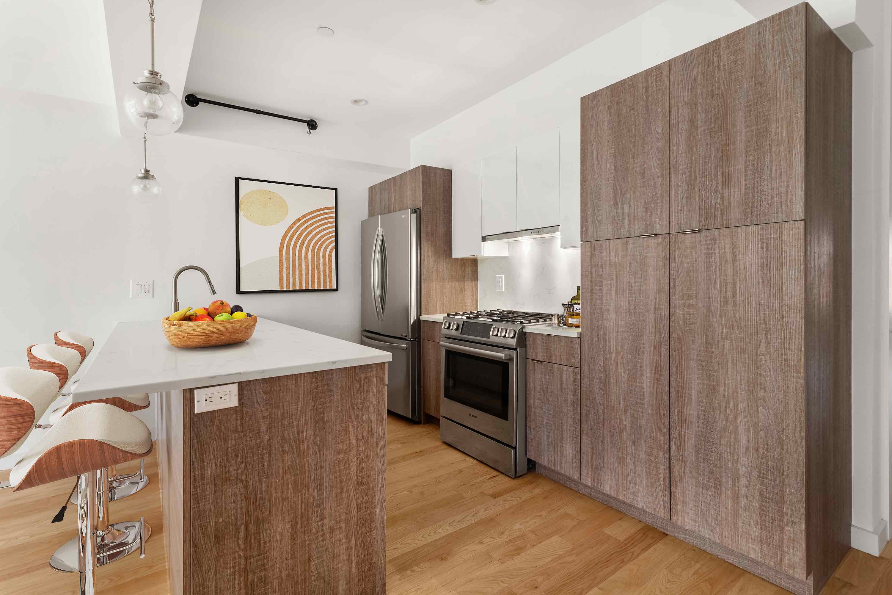 320 Humboldt Street, Unit 2 Brooklyn, NY 11211 - Photo 2 of 10 a kitchen with stainless steel appliances a stove a sink and a refrigerator
