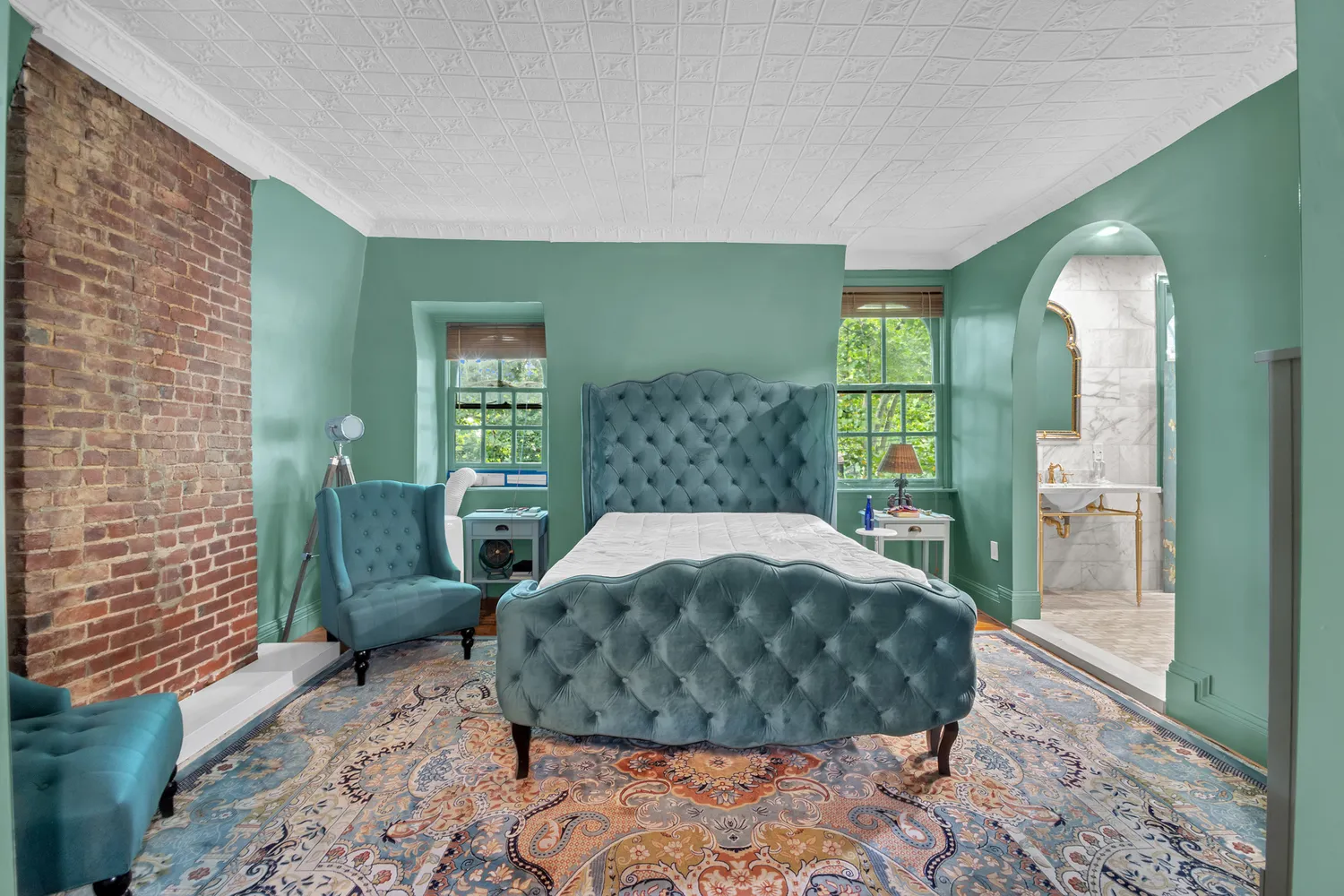 a bathroom with a sink mirror and a bathtub