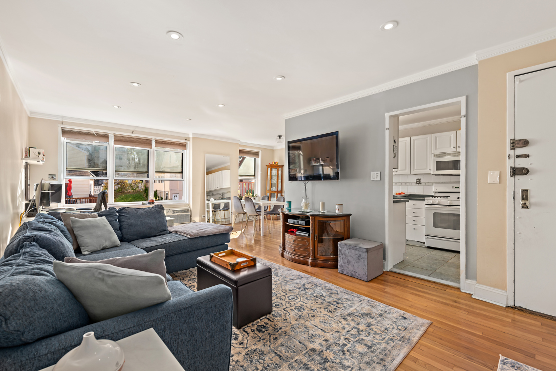 5730 Mosholu Avenue, Unit 4F Bronx, NY 10471 - Photo 3 of 15 a living room with furniture and a flat screen tv
