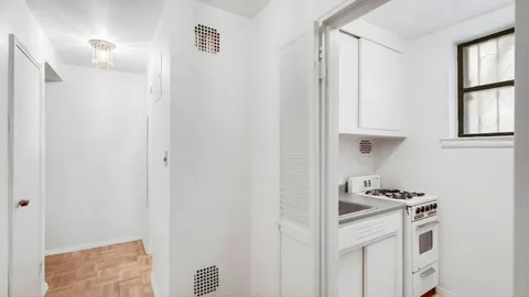 a kitchen with stainless steel appliances granite countertop a sink and a refrigerator